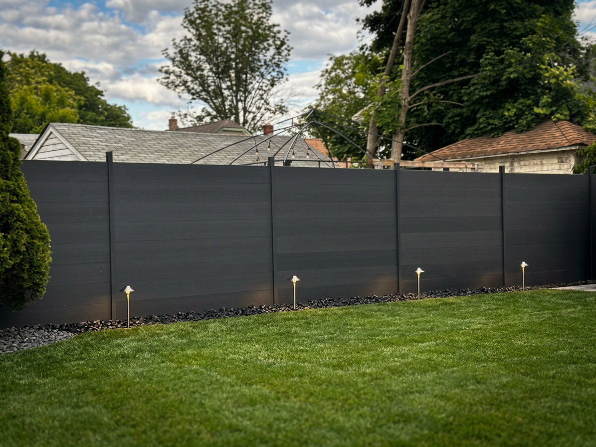 Privacy fence around a landscaped garden